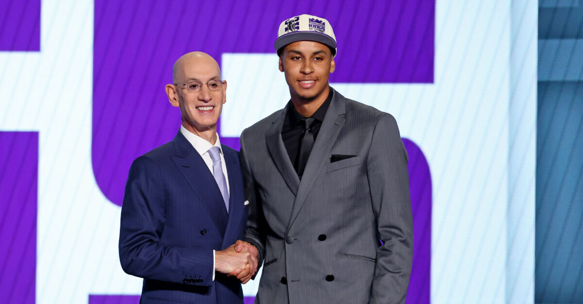 Detroit Pistons draft pick guard Jaden Ivey adjusts his cap before